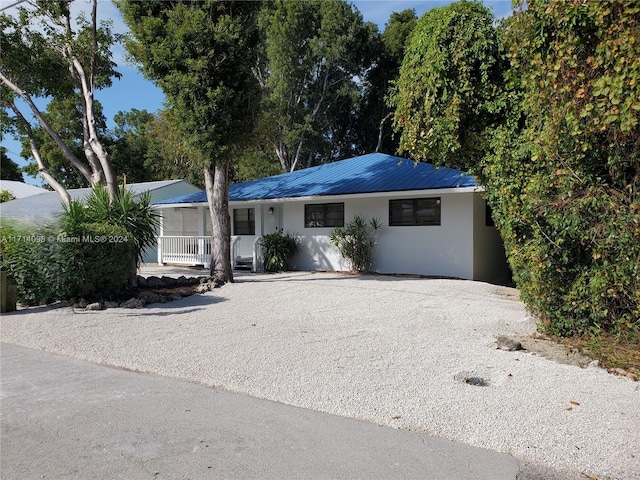 single story home featuring a porch