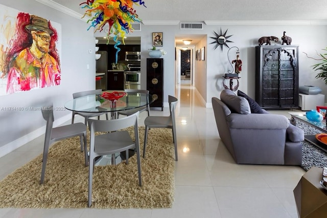 dining space with visible vents, crown molding, a textured ceiling, and light tile patterned floors