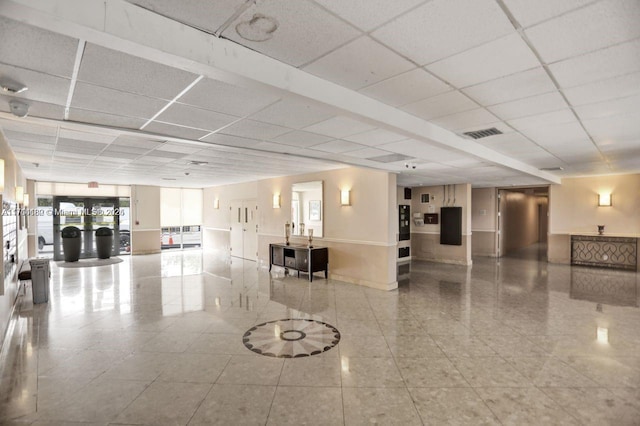 building lobby featuring visible vents