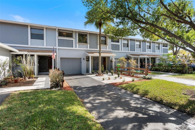 townhome / multi-family property featuring a garage