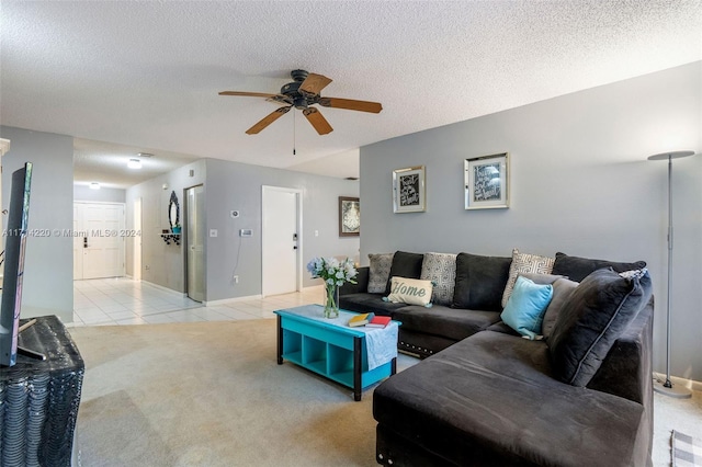 tiled living room with ceiling fan and a textured ceiling