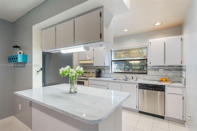 kitchen with light tile patterned floors, white cabinetry, sink, and appliances with stainless steel finishes