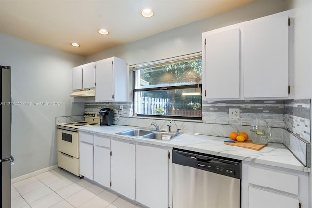 kitchen featuring white cabinets, sink, stainless steel appliances, and tasteful backsplash