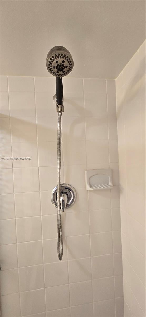 room details with a tile shower