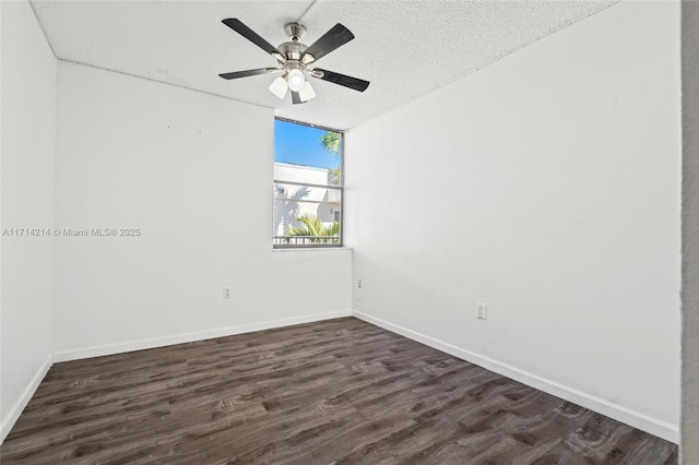 empty room featuring a textured ceiling, dark hardwood / wood-style floors, and ceiling fan