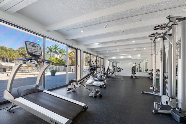 gym featuring a textured ceiling