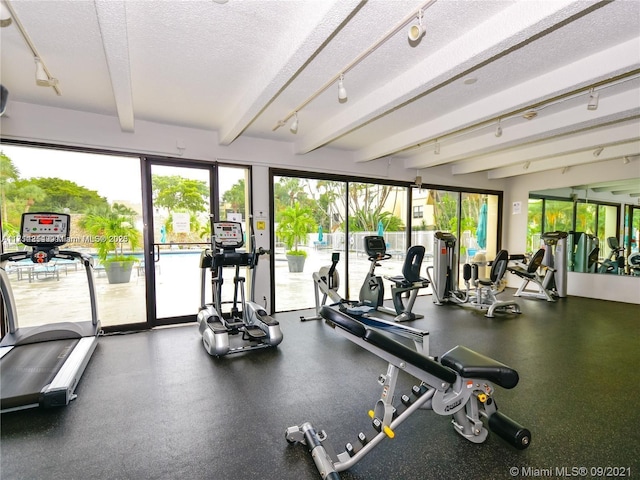 workout area with a textured ceiling