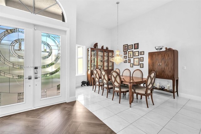 821 E Cypress Pointe Dr E, Pembroke Pines, FL 33027 - dining area with a chandelier and a high ceiling
