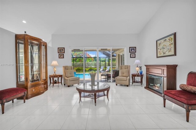 821 E Cypress Pointe Dr E, Pembroke Pines, FL 33027 - living room featuring a glass covered fireplace, recessed lighting, and light tile patterned flooring