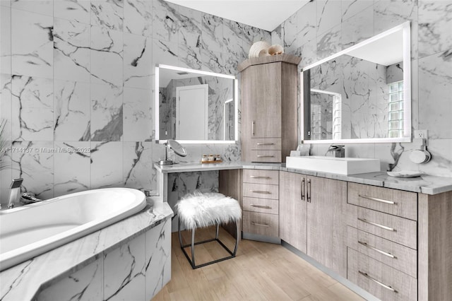 821 E Cypress Pointe Dr E, Pembroke Pines, FL 33027 - bathroom featuring vanity, a bath, wood finished floors, and tile walls