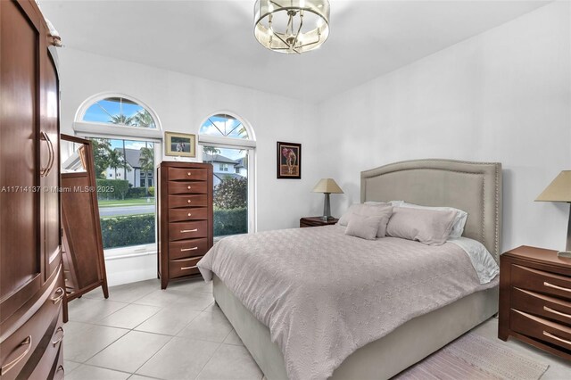 821 E Cypress Pointe Dr E, Pembroke Pines, FL 33027 - bedroom featuring a chandelier and light tile patterned floors