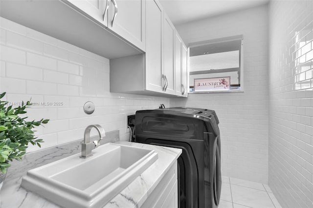 821 E Cypress Pointe Dr E, Pembroke Pines, FL 33027 - laundry room with tile walls, cabinet space, and washer and clothes dryer