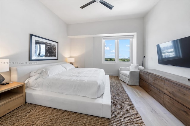 bedroom with ceiling fan and light hardwood / wood-style flooring