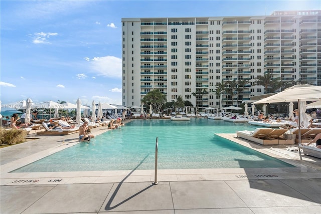 view of pool with a water view