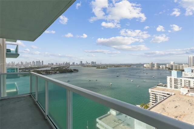 balcony featuring a water view