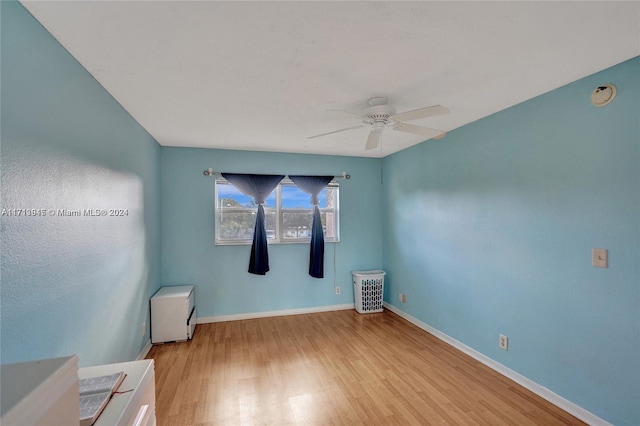 unfurnished room featuring ceiling fan and light hardwood / wood-style flooring