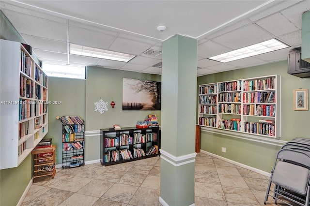 interior space featuring a drop ceiling