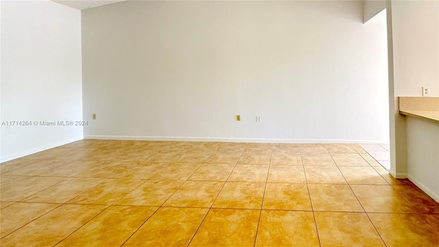 unfurnished room featuring tile patterned floors