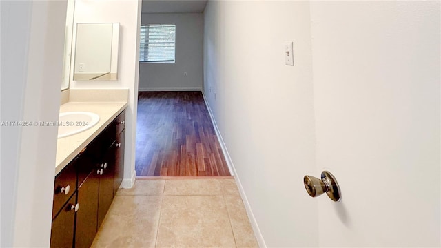 bathroom with tile patterned floors and vanity