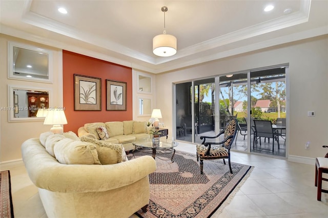 tiled living room with a tray ceiling and crown molding