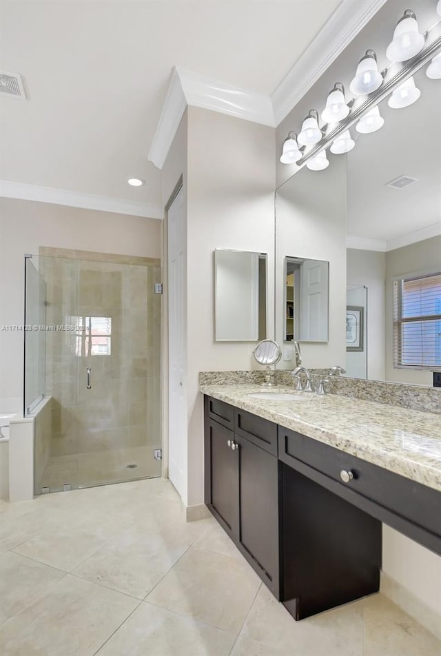 bathroom with vanity, tile patterned floors, an enclosed shower, and crown molding