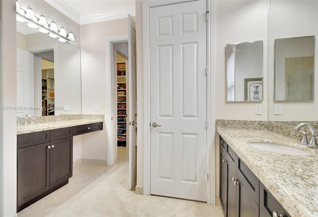 bathroom featuring tile patterned flooring and vanity