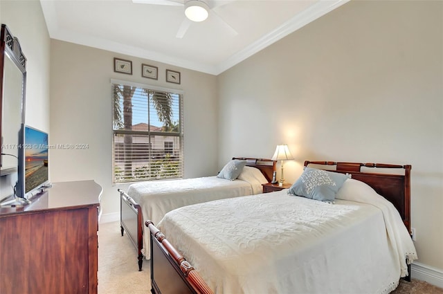 bedroom with ceiling fan, light colored carpet, and ornamental molding