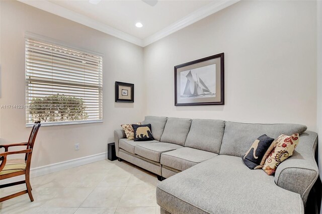 living room with light tile patterned flooring and crown molding