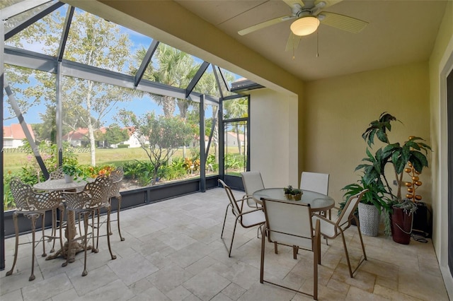 sunroom with ceiling fan and a healthy amount of sunlight