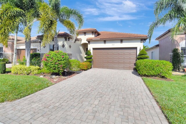 mediterranean / spanish-style home featuring a garage