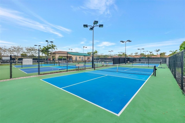 view of sport court featuring basketball hoop