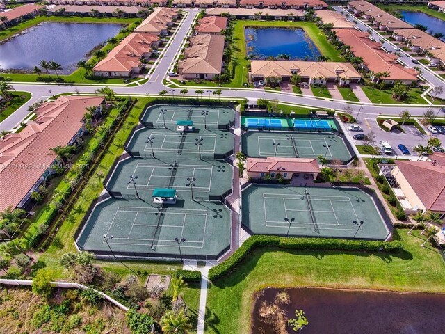 birds eye view of property with a water view