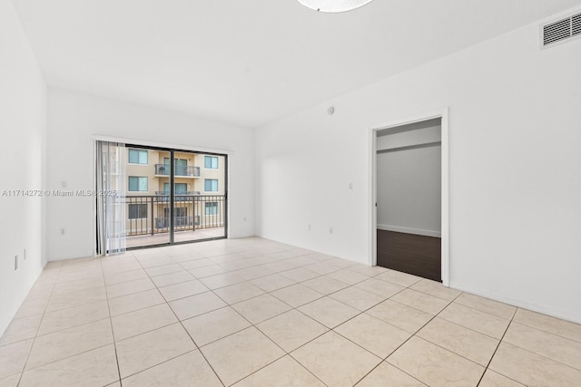 view of tiled spare room