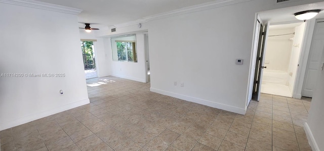 empty room featuring ornamental molding, light tile patterned flooring, and ceiling fan