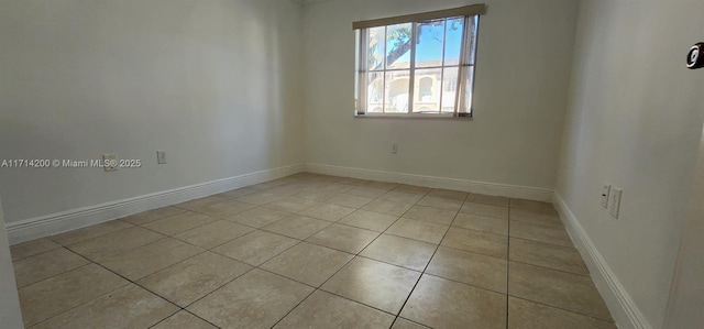 spare room featuring light tile patterned floors