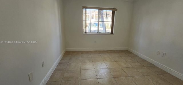 spare room with light tile patterned flooring