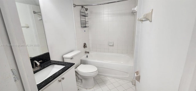 full bathroom featuring tile patterned flooring, tiled shower / bath, vanity, and toilet