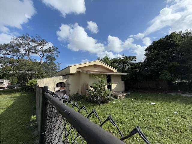 view of property exterior featuring a yard