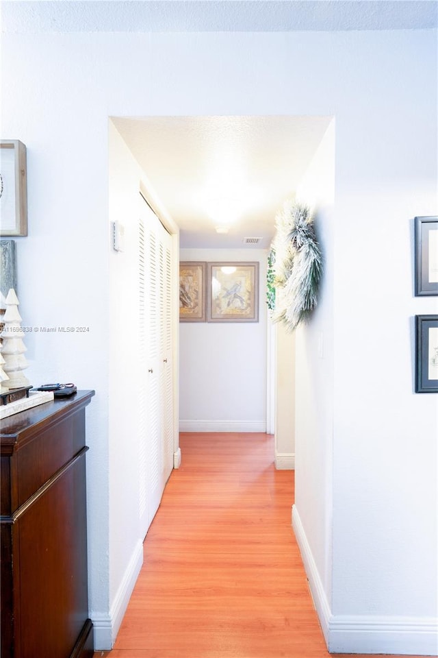 hall featuring light hardwood / wood-style flooring