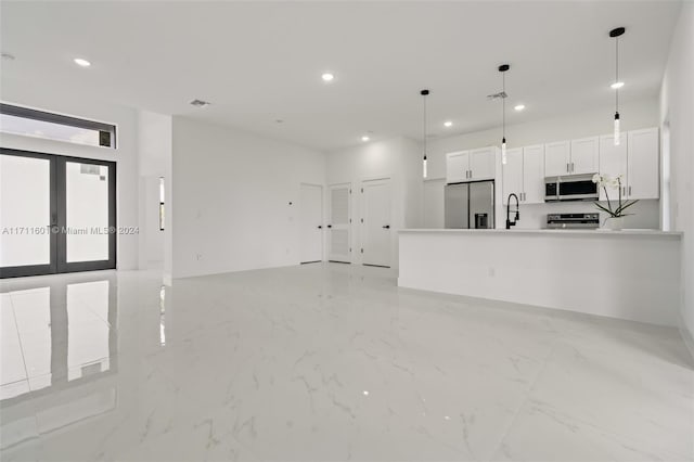 unfurnished living room with sink