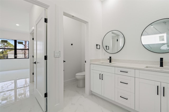 bathroom with vanity and toilet