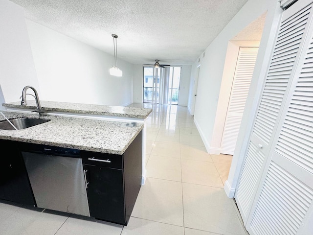 kitchen featuring stainless steel dishwasher, ceiling fan, sink, pendant lighting, and light tile patterned floors