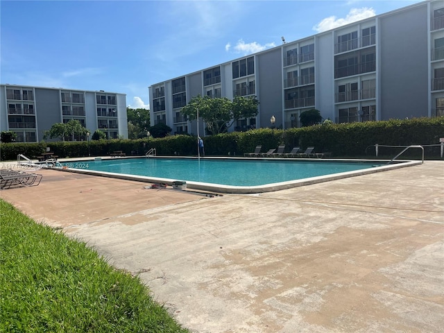 view of swimming pool featuring a patio area