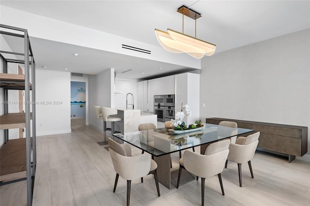 dining space featuring light hardwood / wood-style flooring