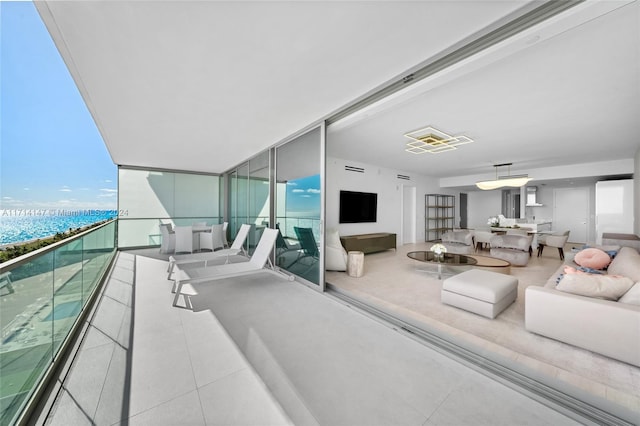 living room with floor to ceiling windows