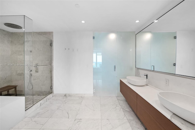 bathroom featuring vanity and an enclosed shower