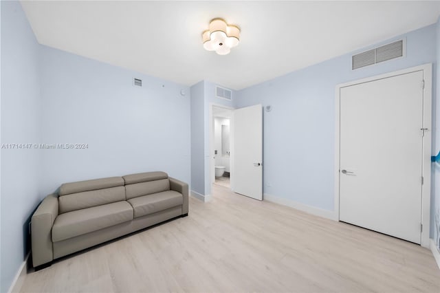 sitting room featuring light hardwood / wood-style floors