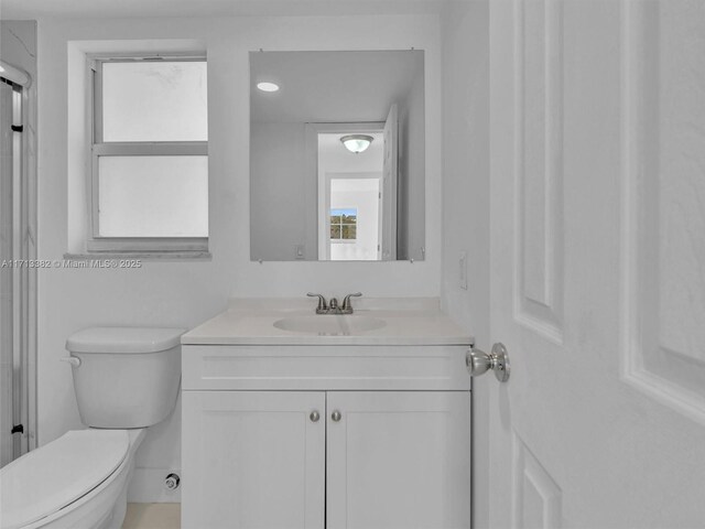 kitchen with white range with electric cooktop, white cabinetry, and light tile patterned floors