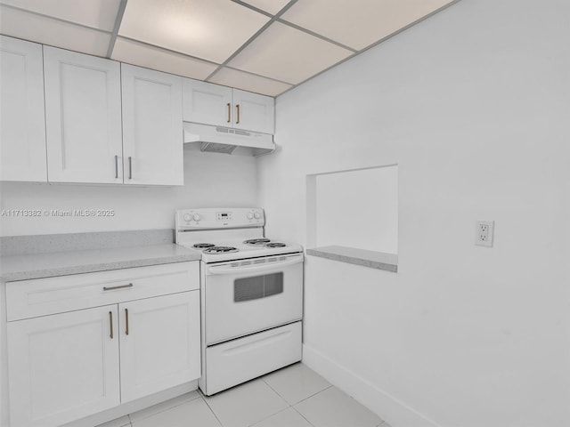 kitchen with white cabinetry, white electric range, light tile patterned flooring, and a drop ceiling