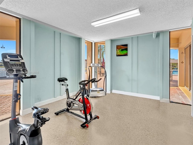 workout room with a textured ceiling